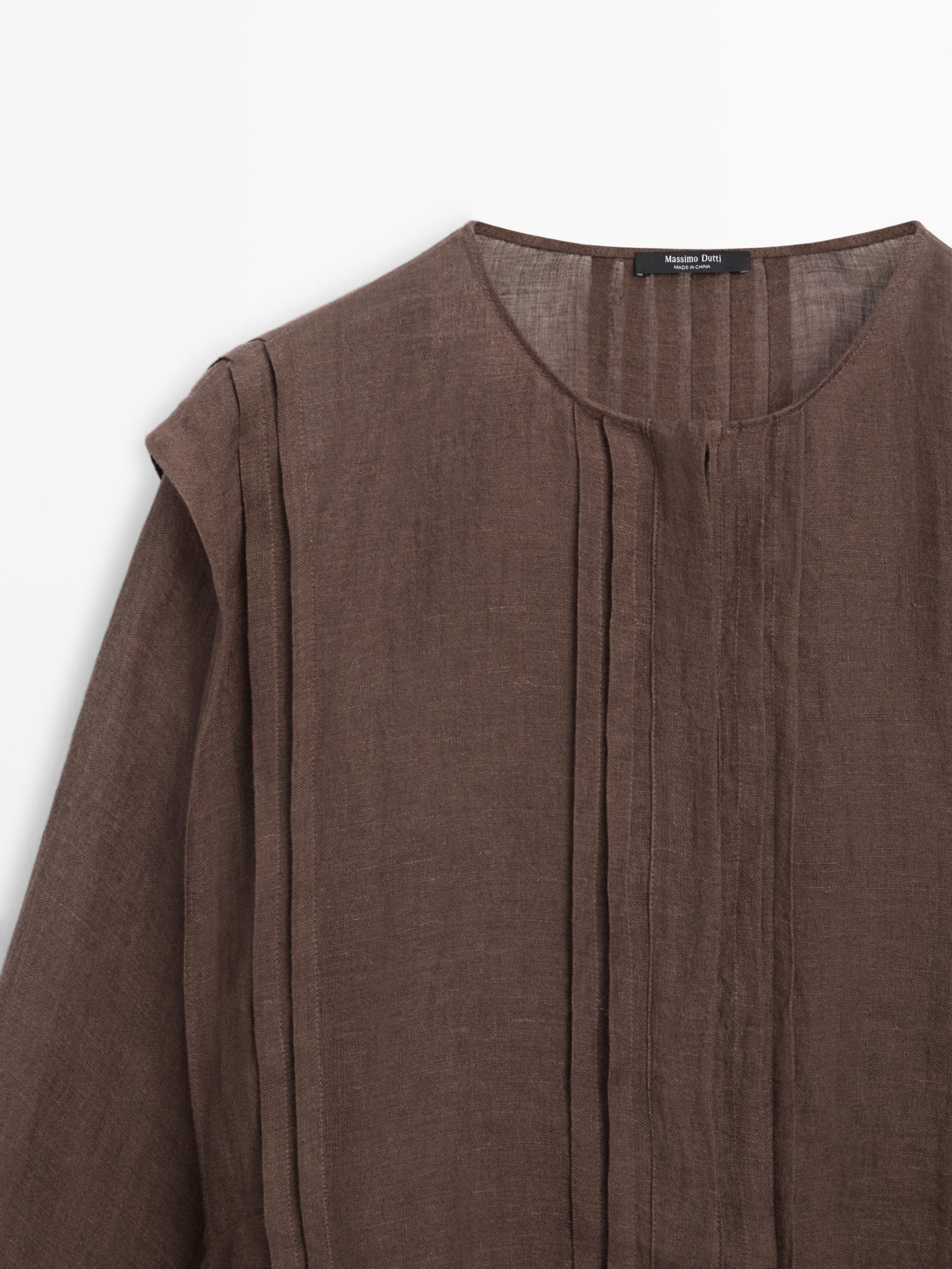 Flowing oversize linen blouse with ruffles